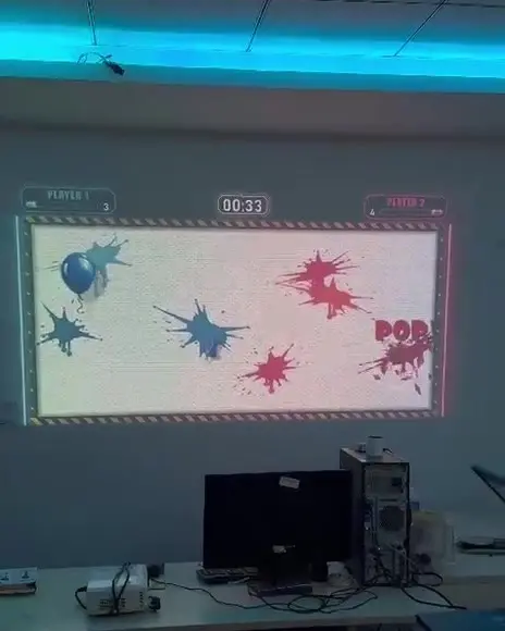 Mid-round, the wall full of paint